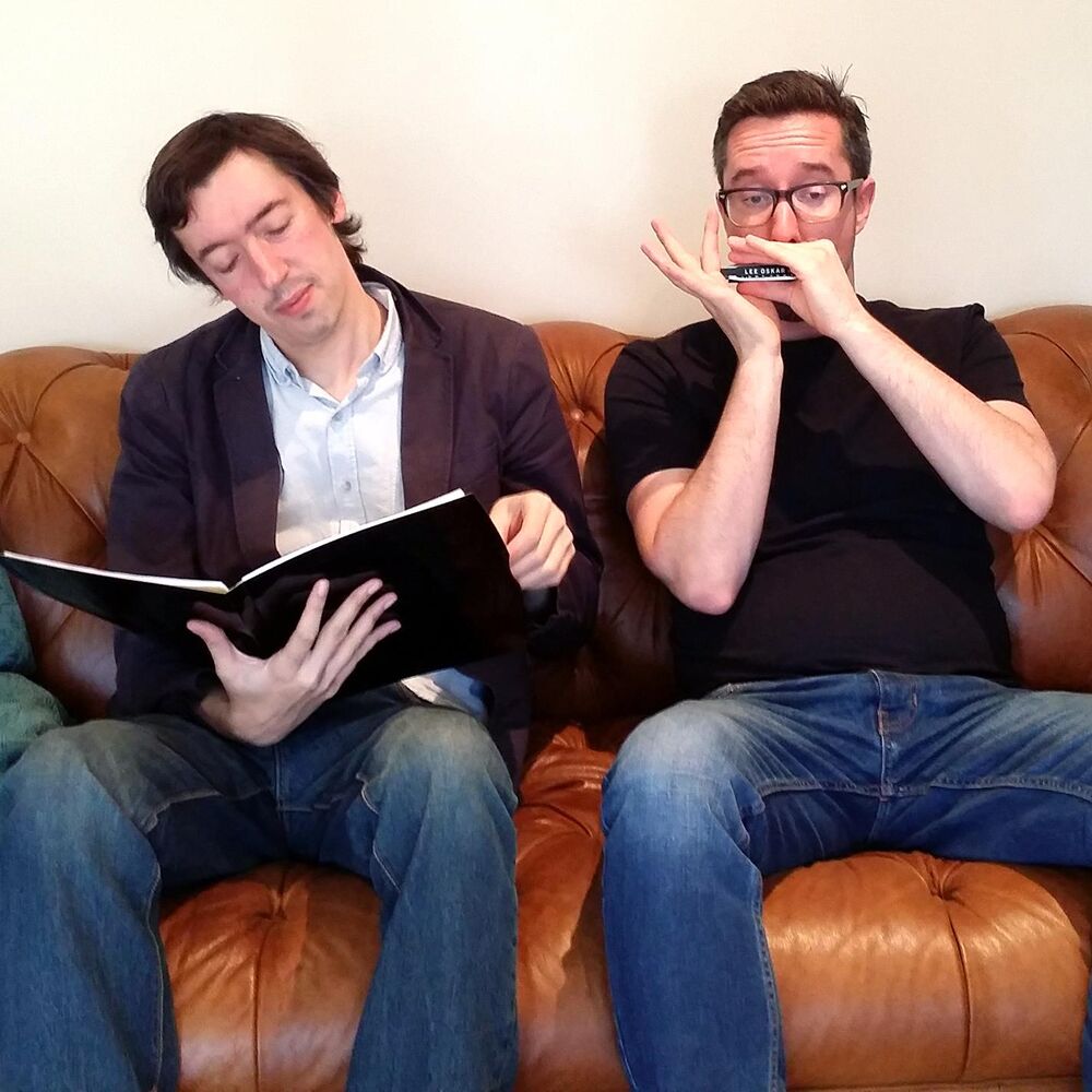 Picture of Paul Richards Reading Some Short Stories Whilst a Man Called Matthew Plays Harmonica Gently in the Background